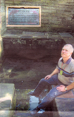 Wonder: Mervyn Clayton, a member of Friends of Gledhow Valley Woods, sits near the plunge pool which is fed by a natural spring within the bath house