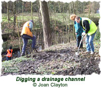Digging a drainage channel