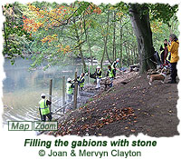 Filling the gabions with stone